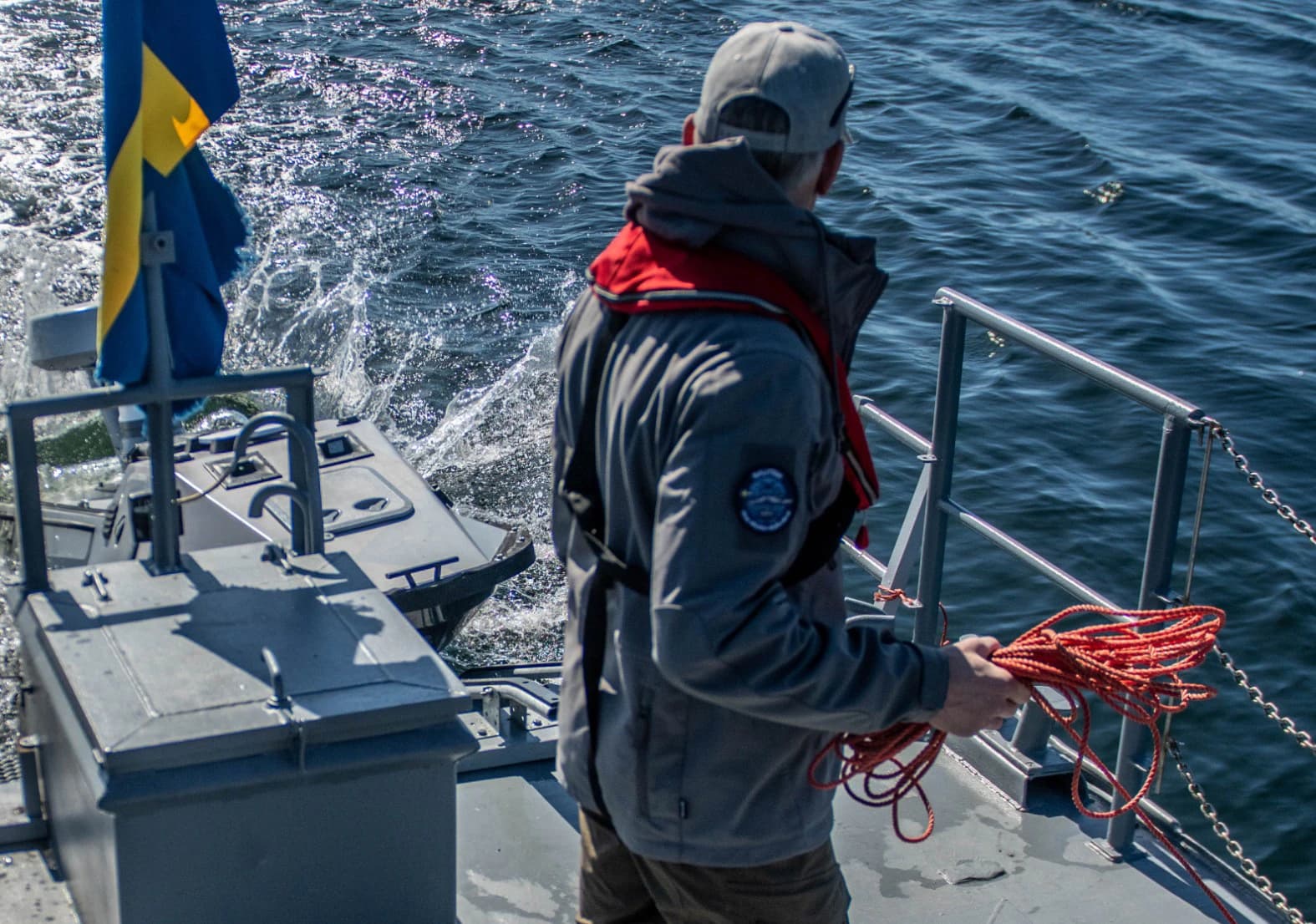 Nautrik operator on deck with a coiled line during the AURORA 26 exercise