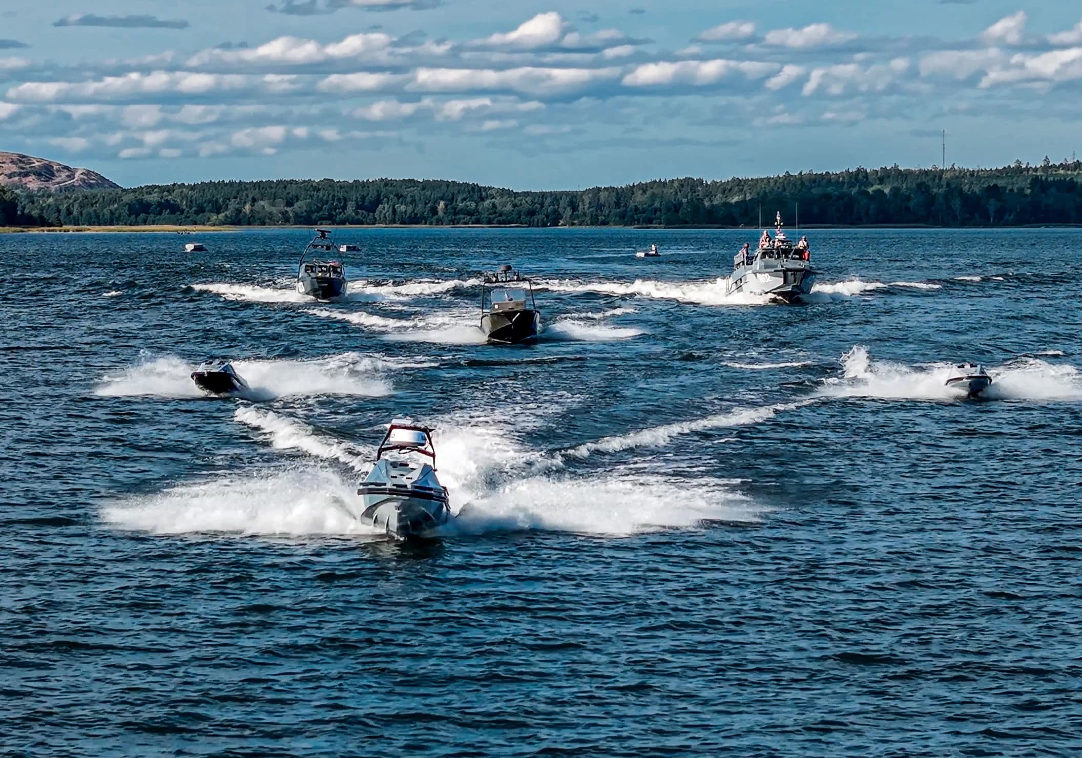 Nautrik vessels running in formation across open water